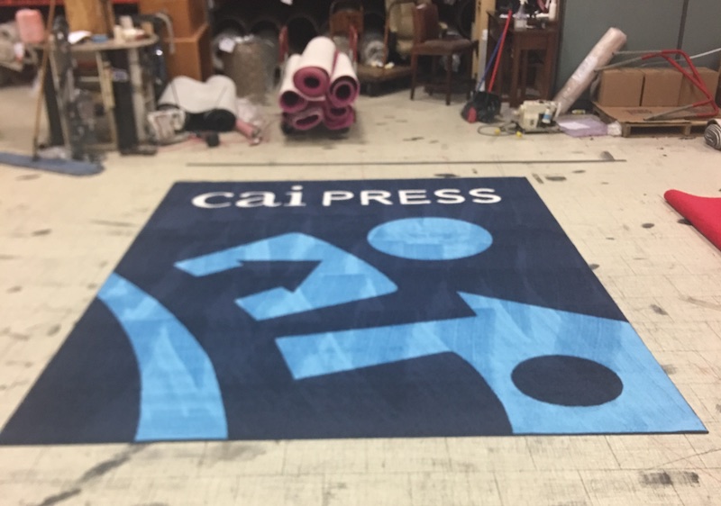 CAI Press logo rug